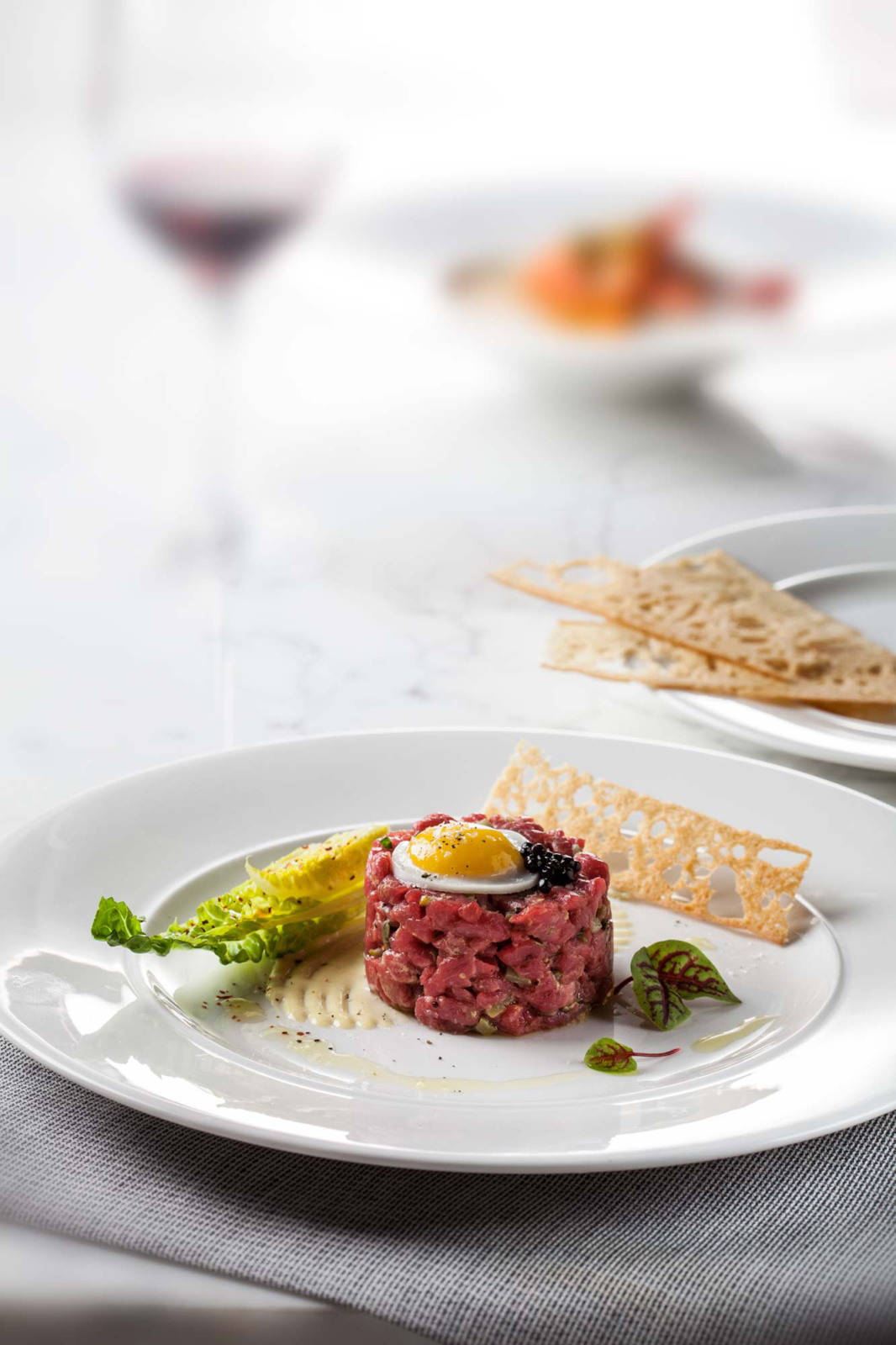 Food photography of beef tartare, art directed by Nesnadny and Schwartz for the Cru Uncorked identity