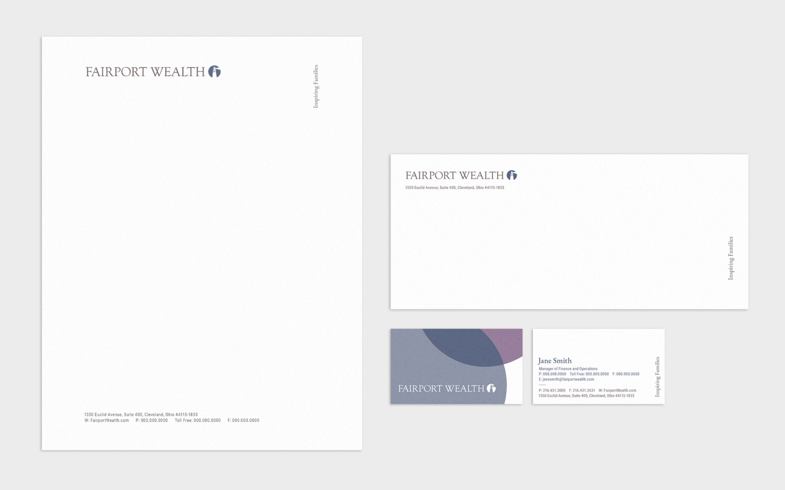 Letterhead, business envelope, and front and back views of the business cards from the new Fairport Wealth identity.
