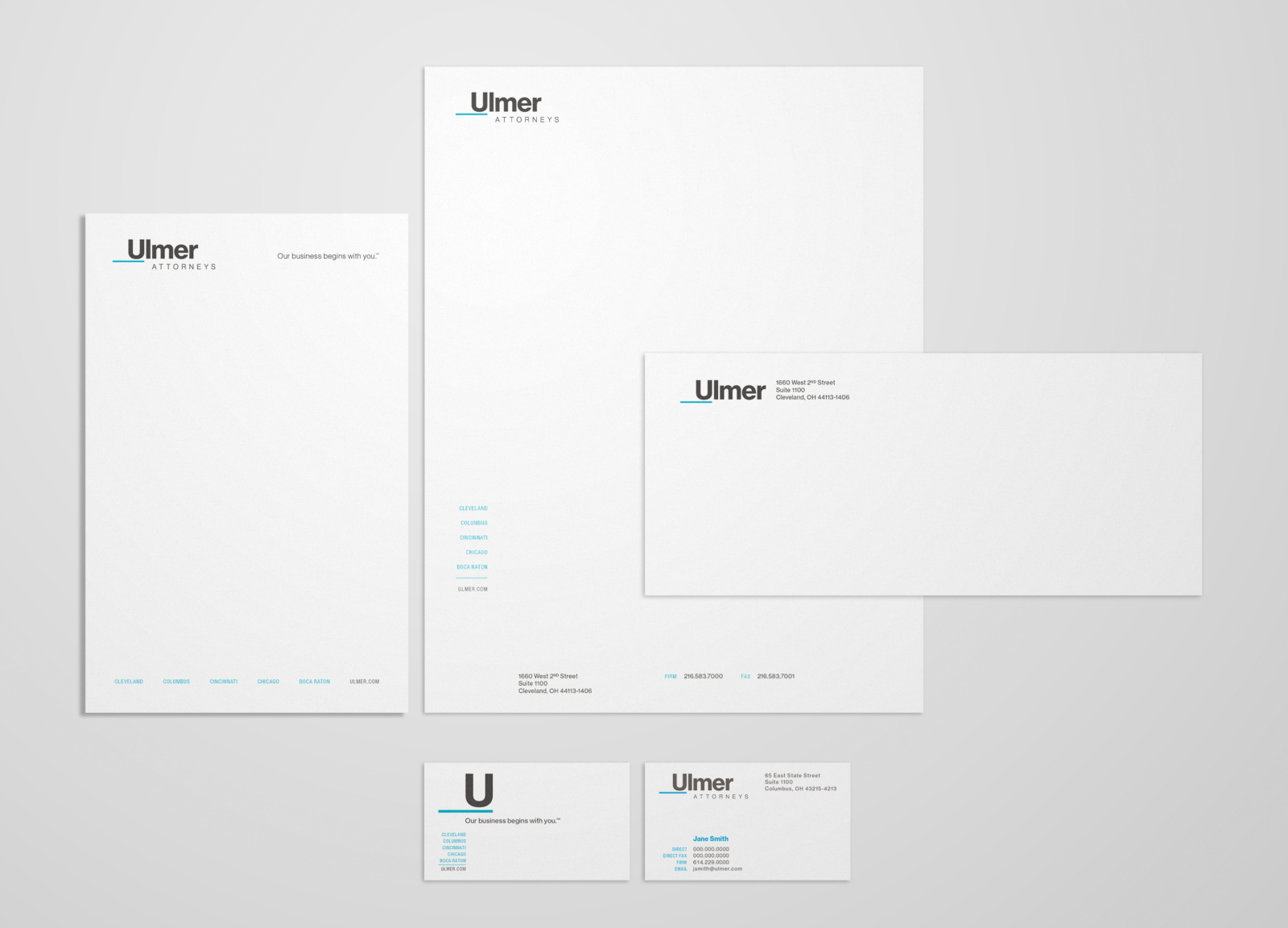 Print design for Ulmer business papers, featuring letterhead, notepad, business cards, and business envelope
